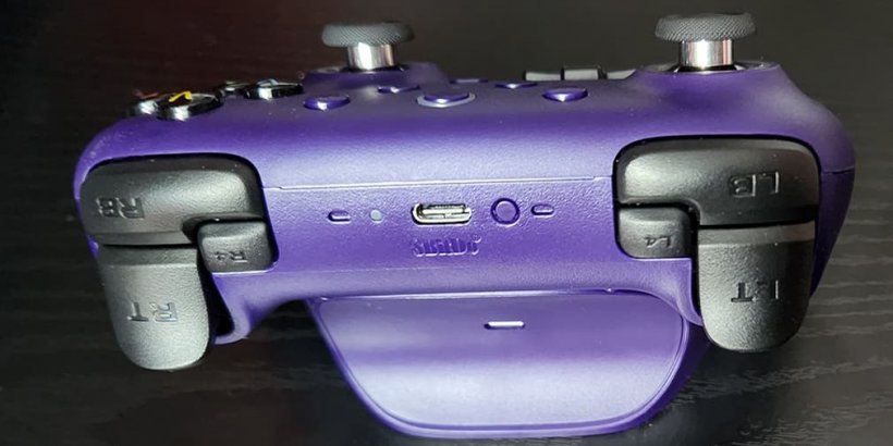 Top view of a purple Ultimate 2 Wireless Controller showing the standard triggers and the extra L4 and R4 triggers